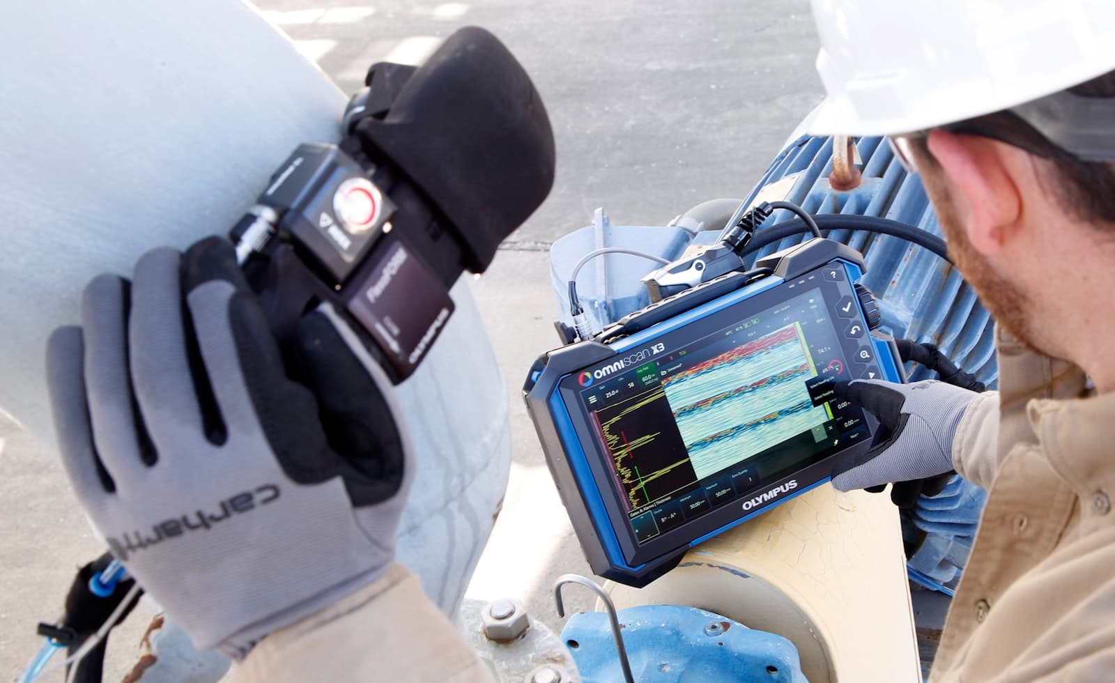 Technician performing ultrasonic testing with a flaw detector
